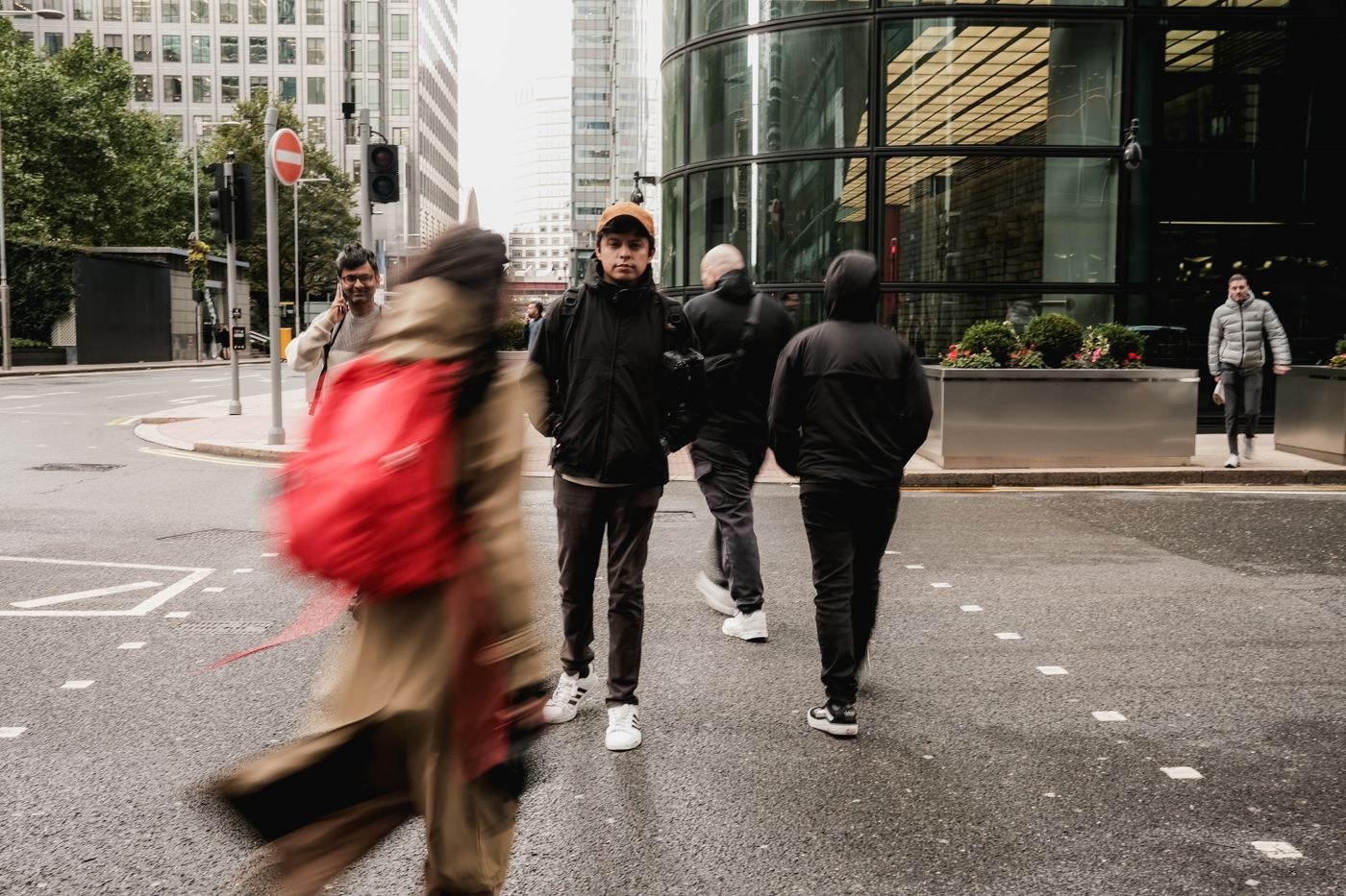 Pedestrians crossing a street with visible motion blur