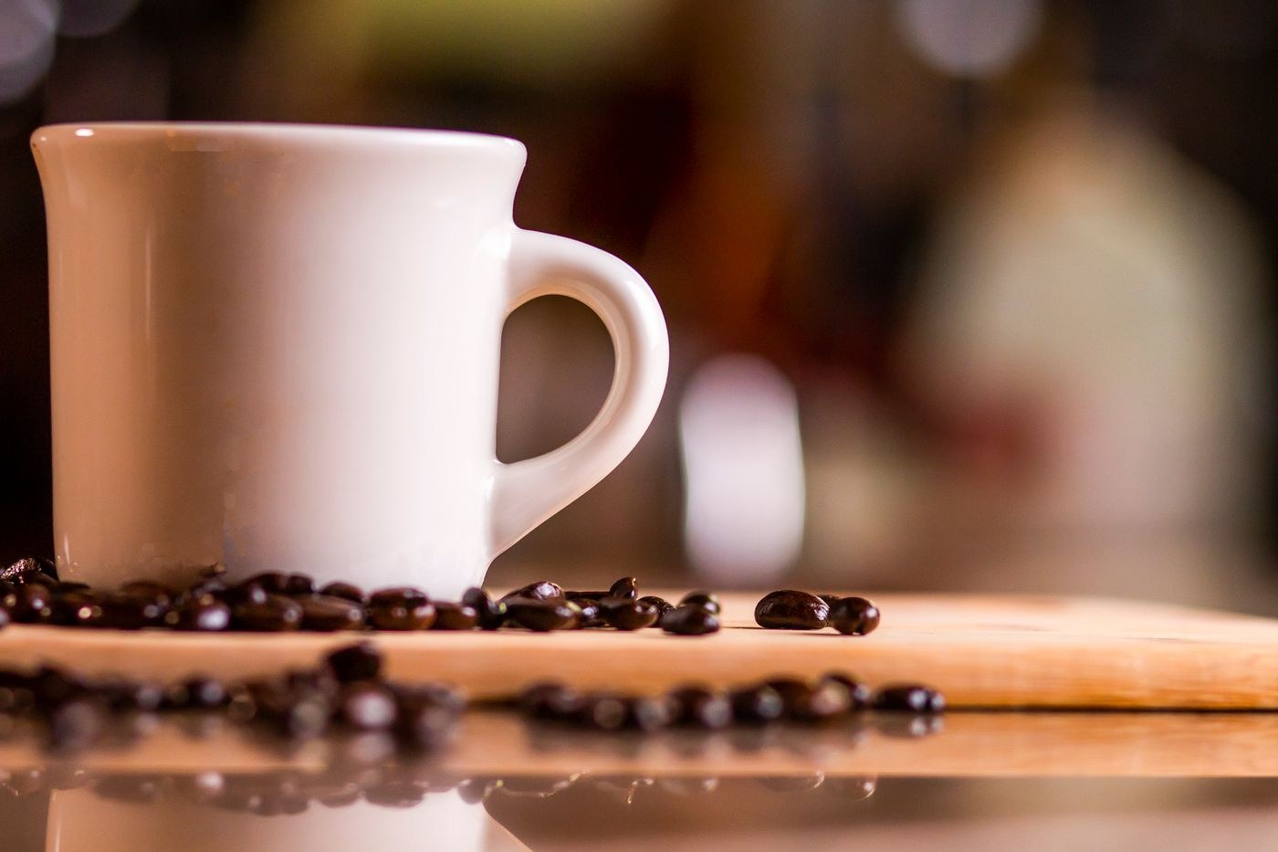 Coffee cup in focus against a blurred background