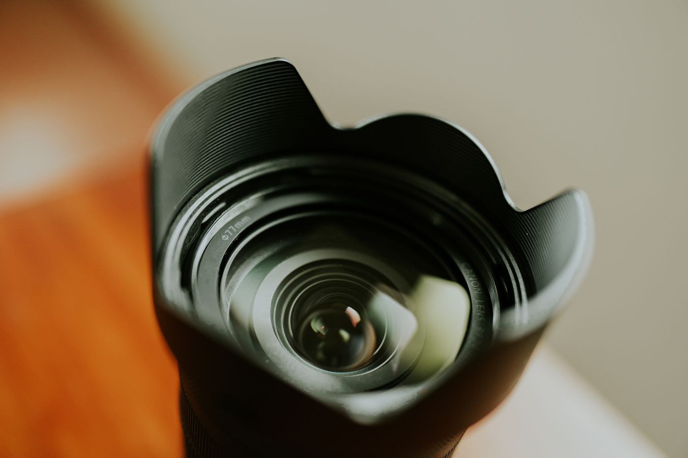 Camera lens with a petal-shaped hood