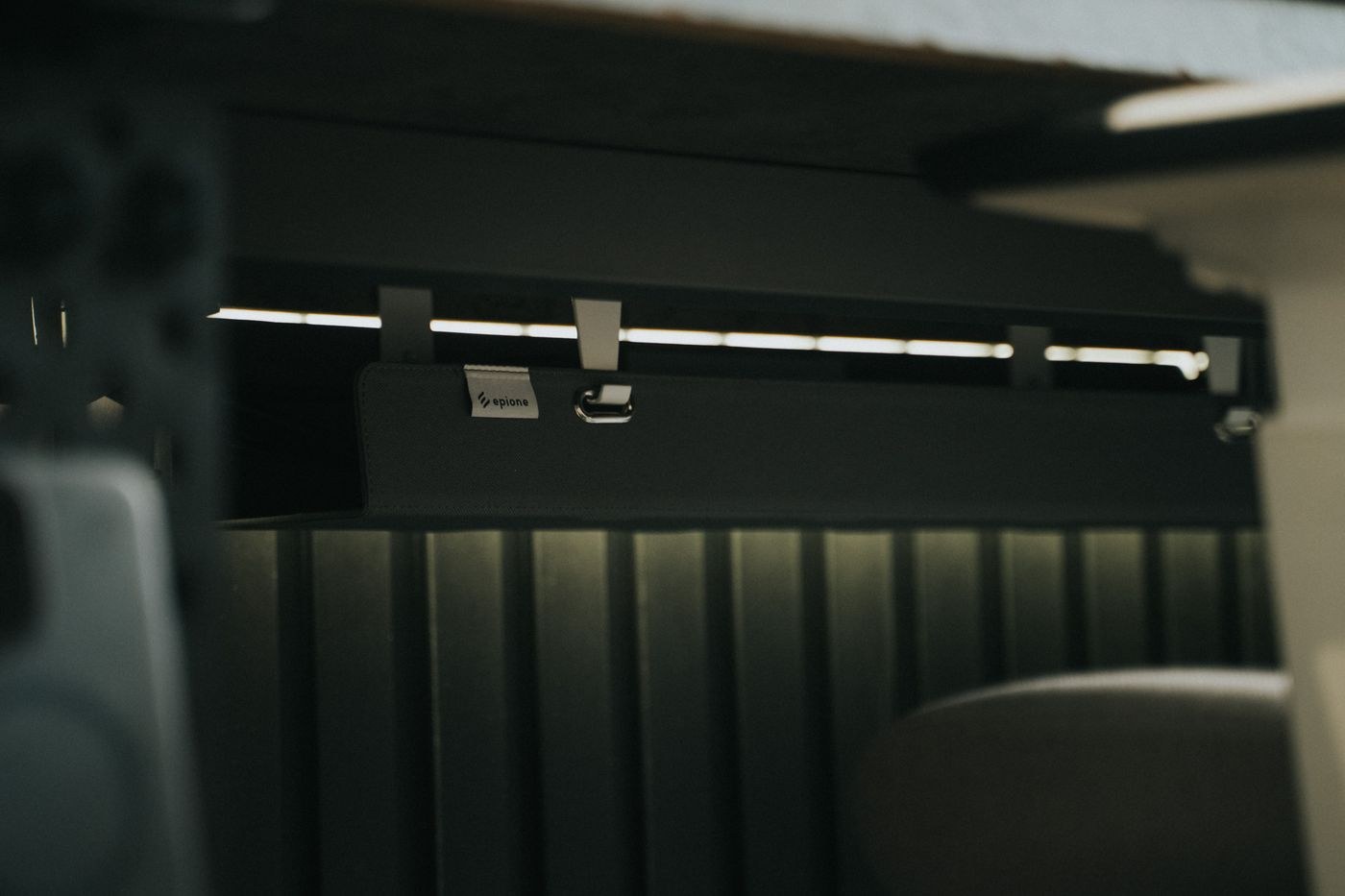 Cable tray attached beneath a desk