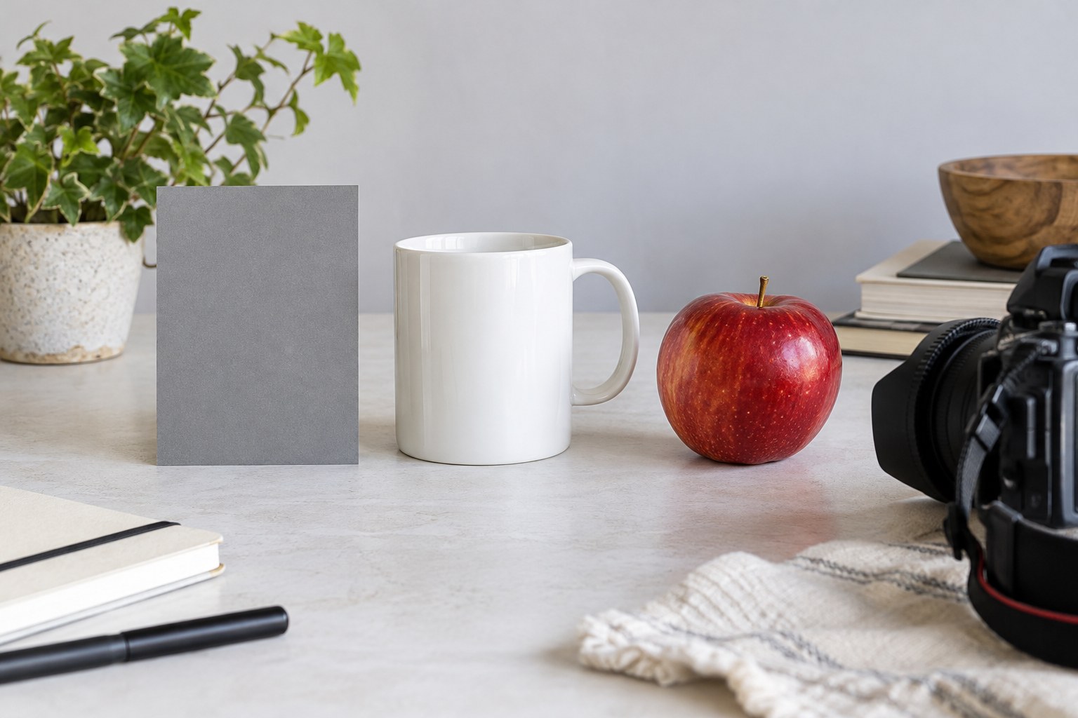Grey reference card beside a white mug and red apple
